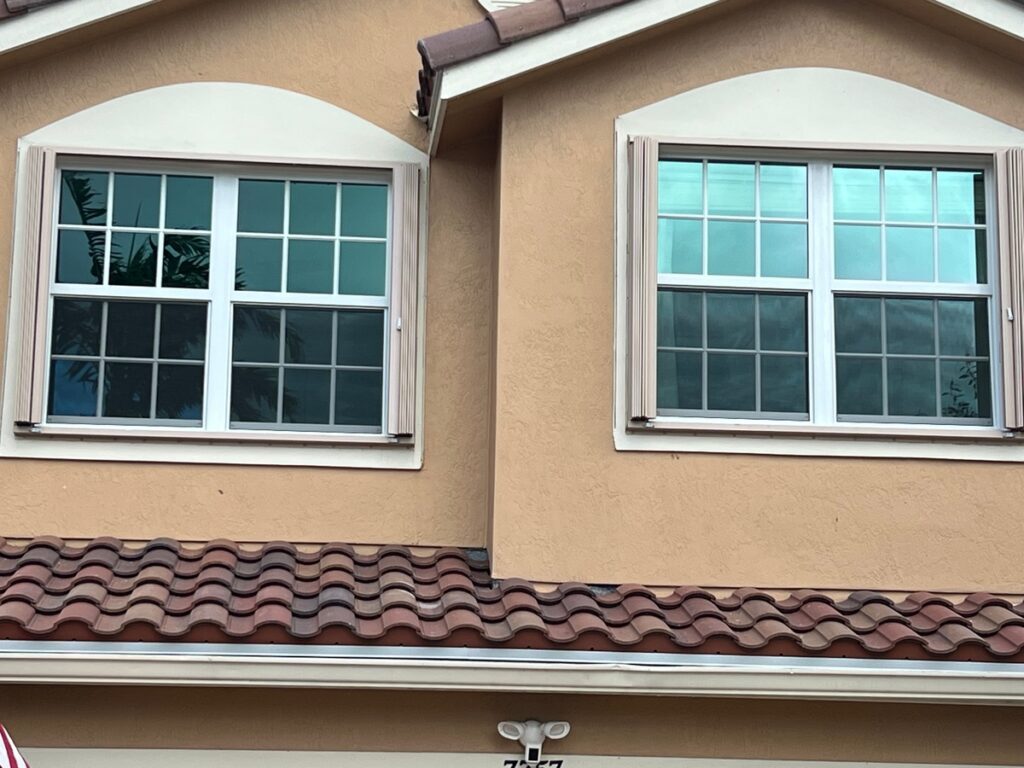 Cut-outTechnician measuring a window openinTechnician measuring a window opening during installationg during installation product graphic showing a window part or hardware component