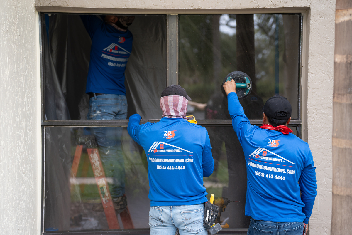 Close-up of a ProGuard technician adjusting a window frame